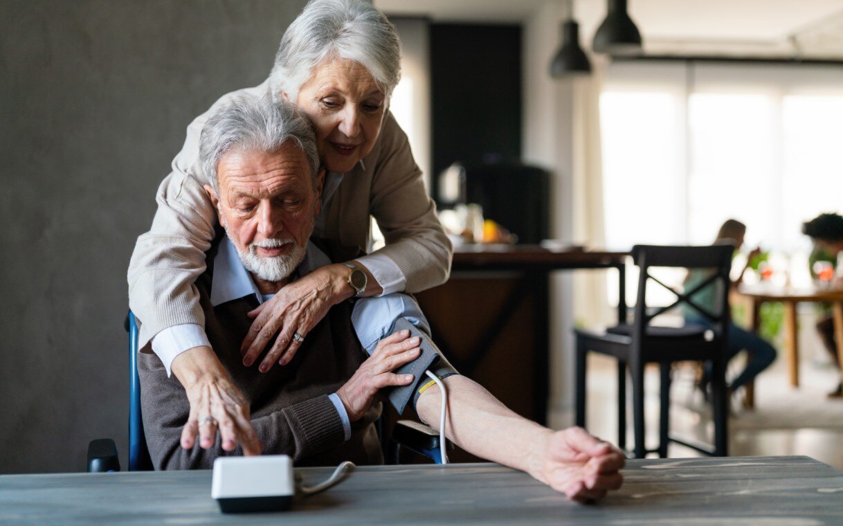 couple measure each others blood pressure